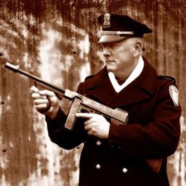 Captain Neil Low In His Uniform Holding Gun